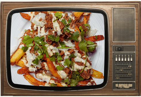 A tv screen shows a plate of chicken wings on it