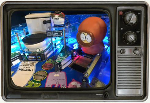 A tv screen shows a plate of food with waffles and chicken