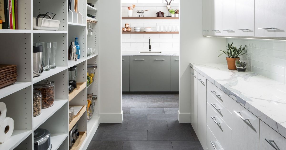 A kitchen with a pantry and a sink in it.
