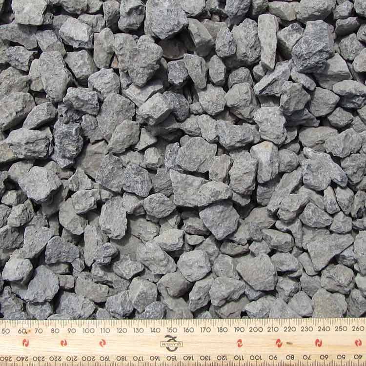 Pile of Gray Gravel With a Ruler Along the Bottom Edge — Kuranda Landscape Supplies in Kuranda, QLD