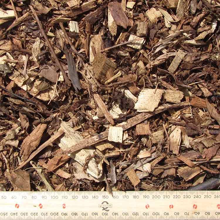 Wood Chips With a Ruler for Scale — Kuranda Landscape Supplies in Kuranda, QLD