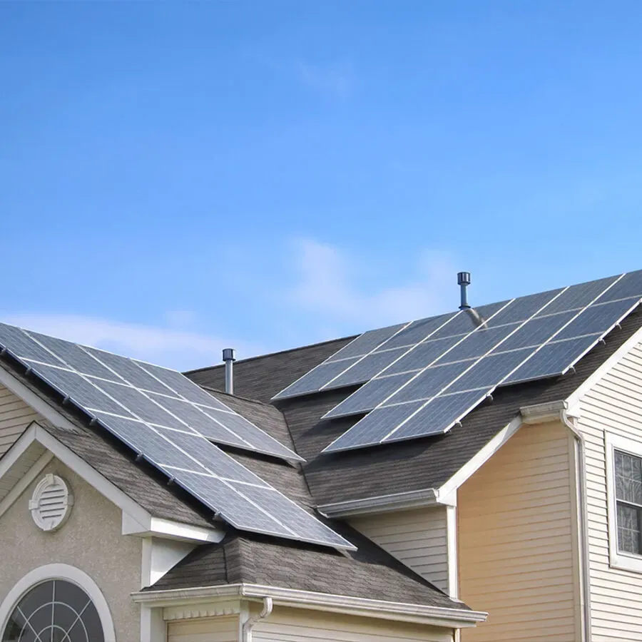 A house with a lot of solar panels on the roof