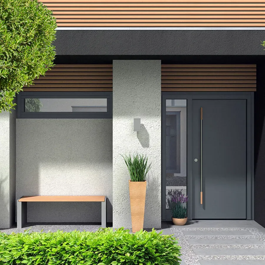 The front of a house with a black door and a wooden bench