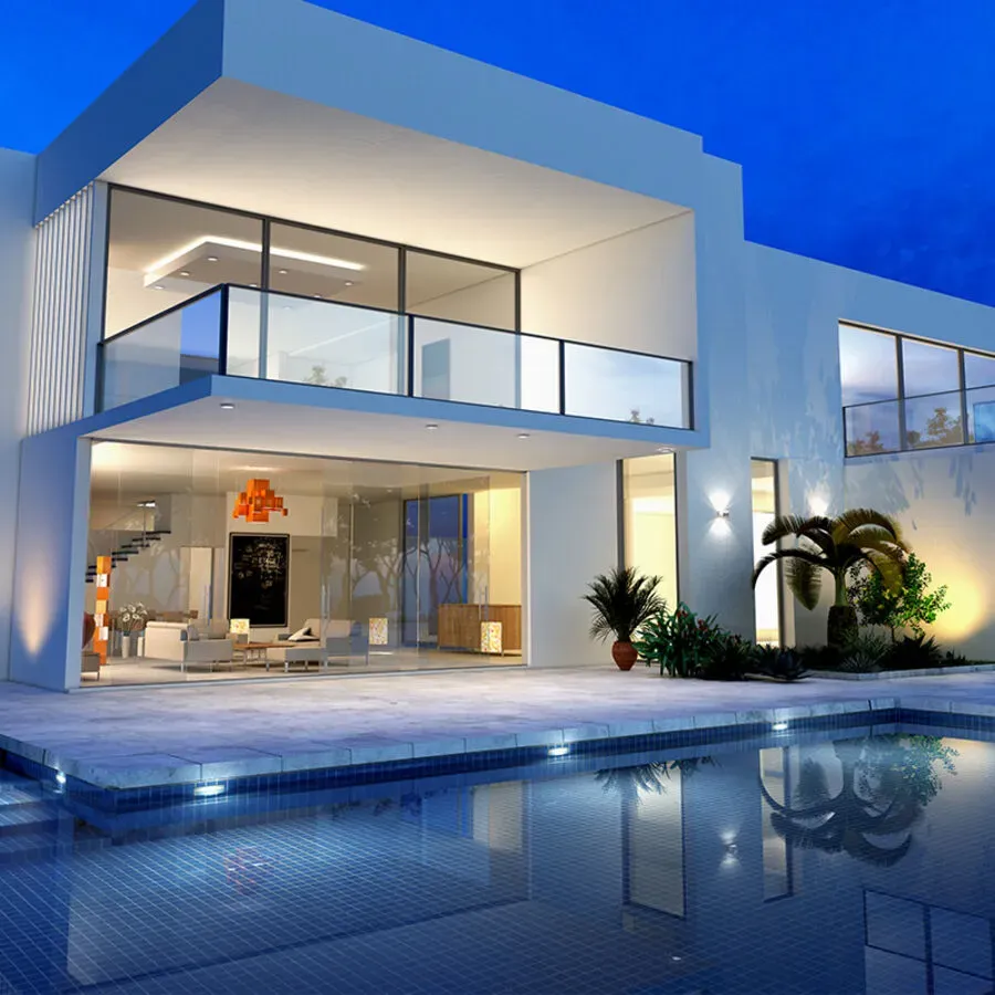 A large white house with a swimming pool in front of it