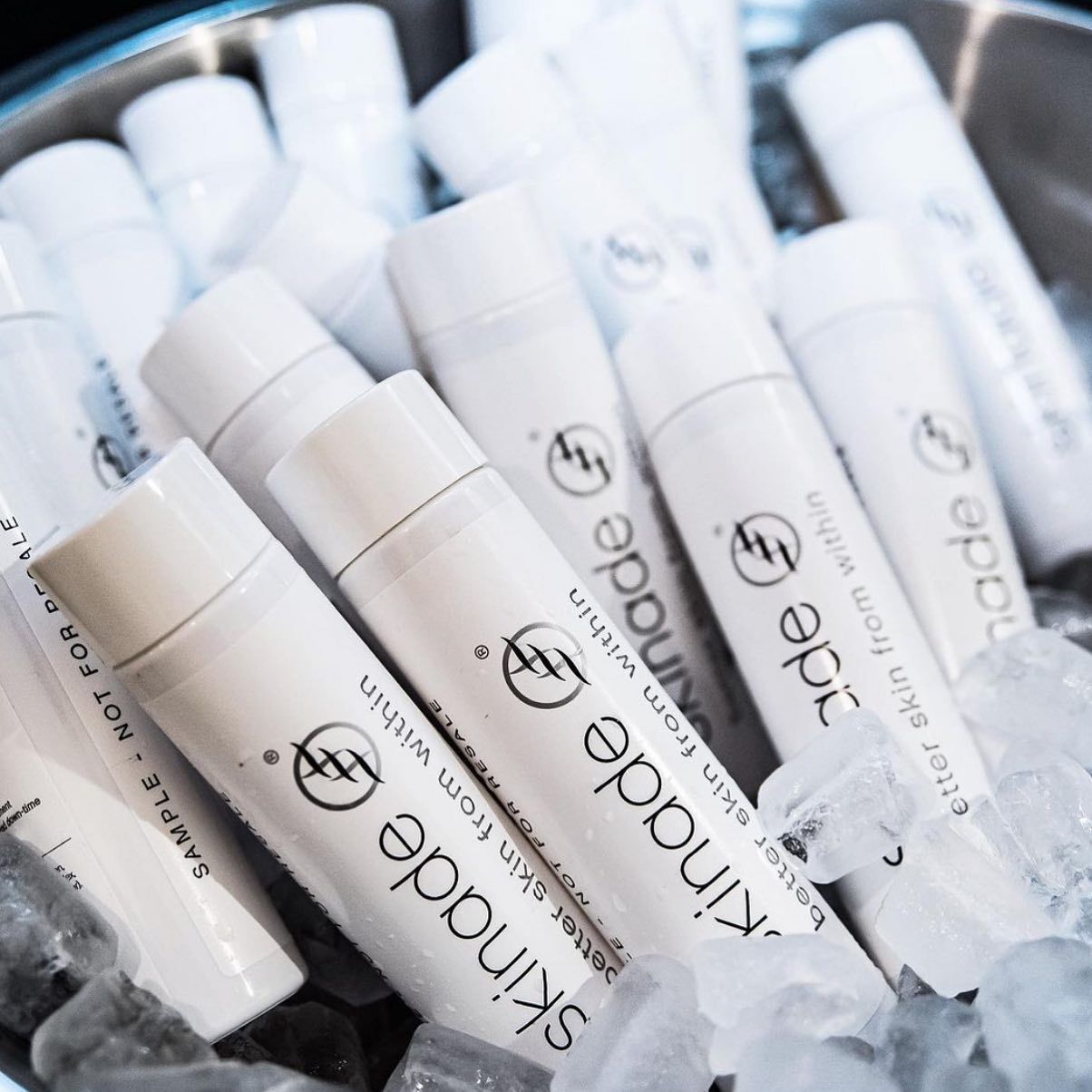 a bunch of kindade lip balms in a bucket of ice