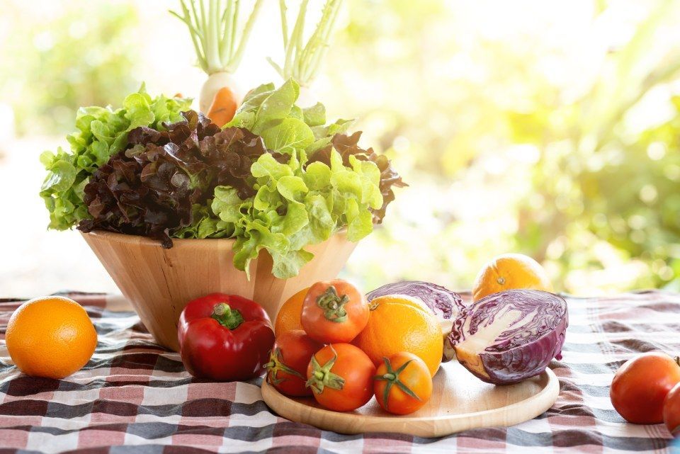 There are many different types of vegetables on the table.