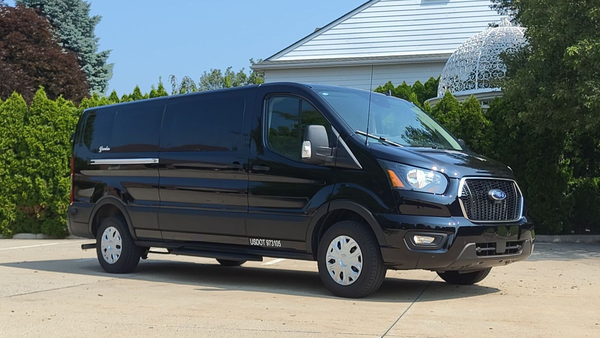 A black ford expedition is parked in a parking lot.