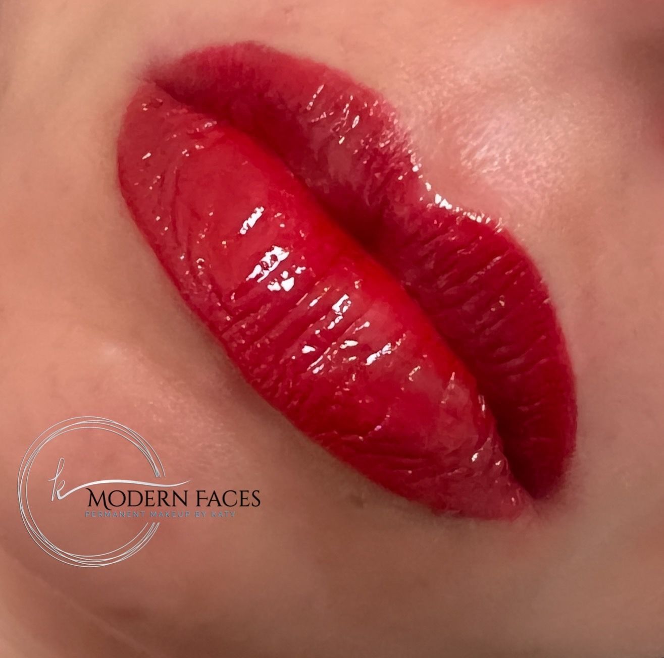 Close-up of glossy red lips with deep burgundy lip liner and a “Modern Faces” watermark