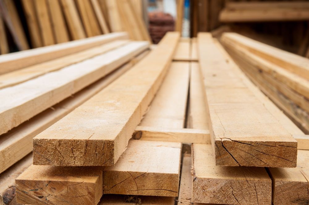 Pile of Wooden Boards Stacked on Top of Each Other in a Warehouse — Ken Willis Joinery Pty Ltd In South Grafton, NSW
