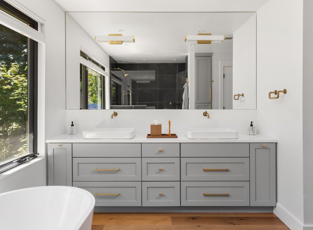 Bathroom With Two Sinks , a Tub , and a Large Mirror — Ken Willis Joinery Pty Ltd In South Grafton, NSW