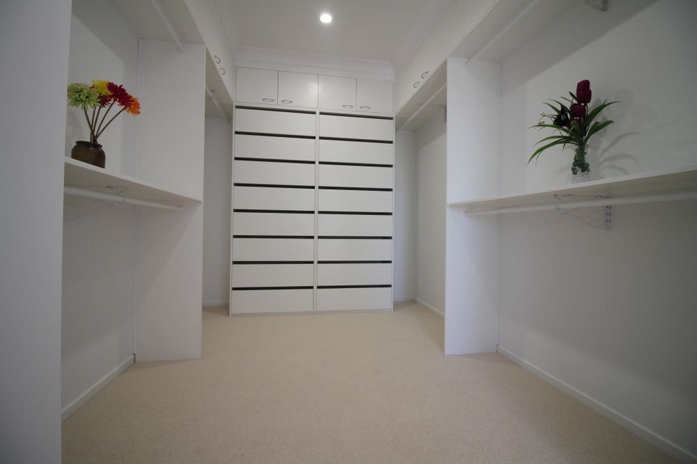 There Are Two Vases of Flowers on the Shelves in the Closet — Ken Willis Joinery Pty Ltd In South Grafton, NSW