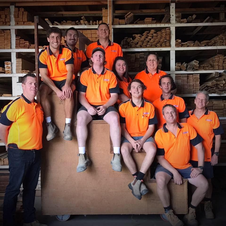 Group of People in Orange Shirts Are Posing for a Picture — Ken Willis Joinery Pty Ltd In South Grafton, NSW