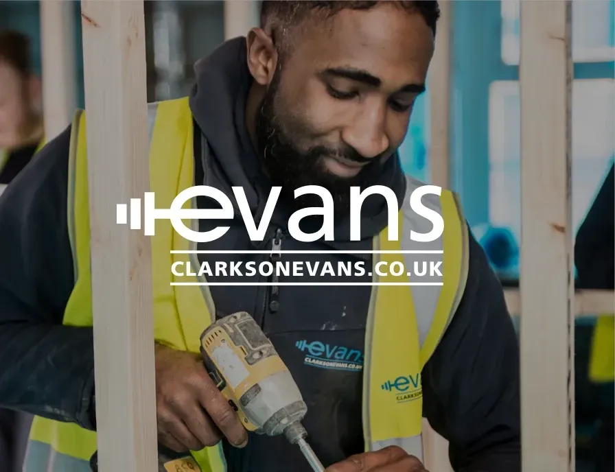 A man in a yellow vest is working with a drill and the logo for clarksonevans.co.uk
