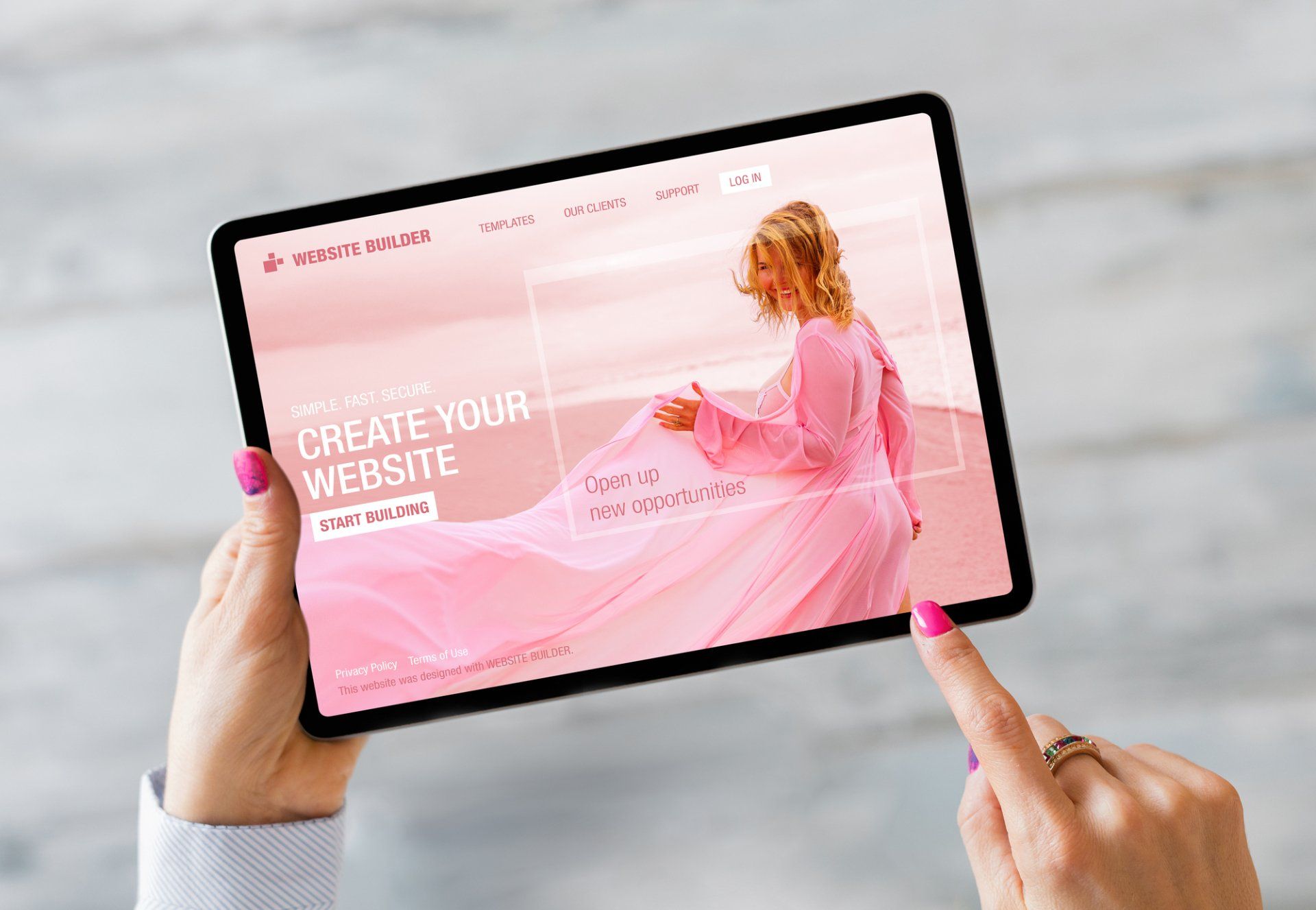 A woman is holding a tablet that says create your website