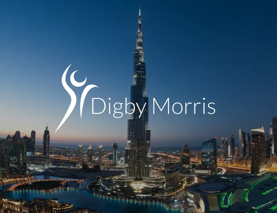 A logo for digby morris with a city in the background