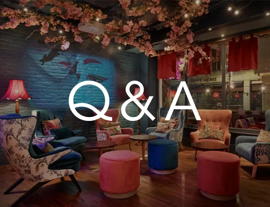 A room with chairs and ottomans and the words q & a