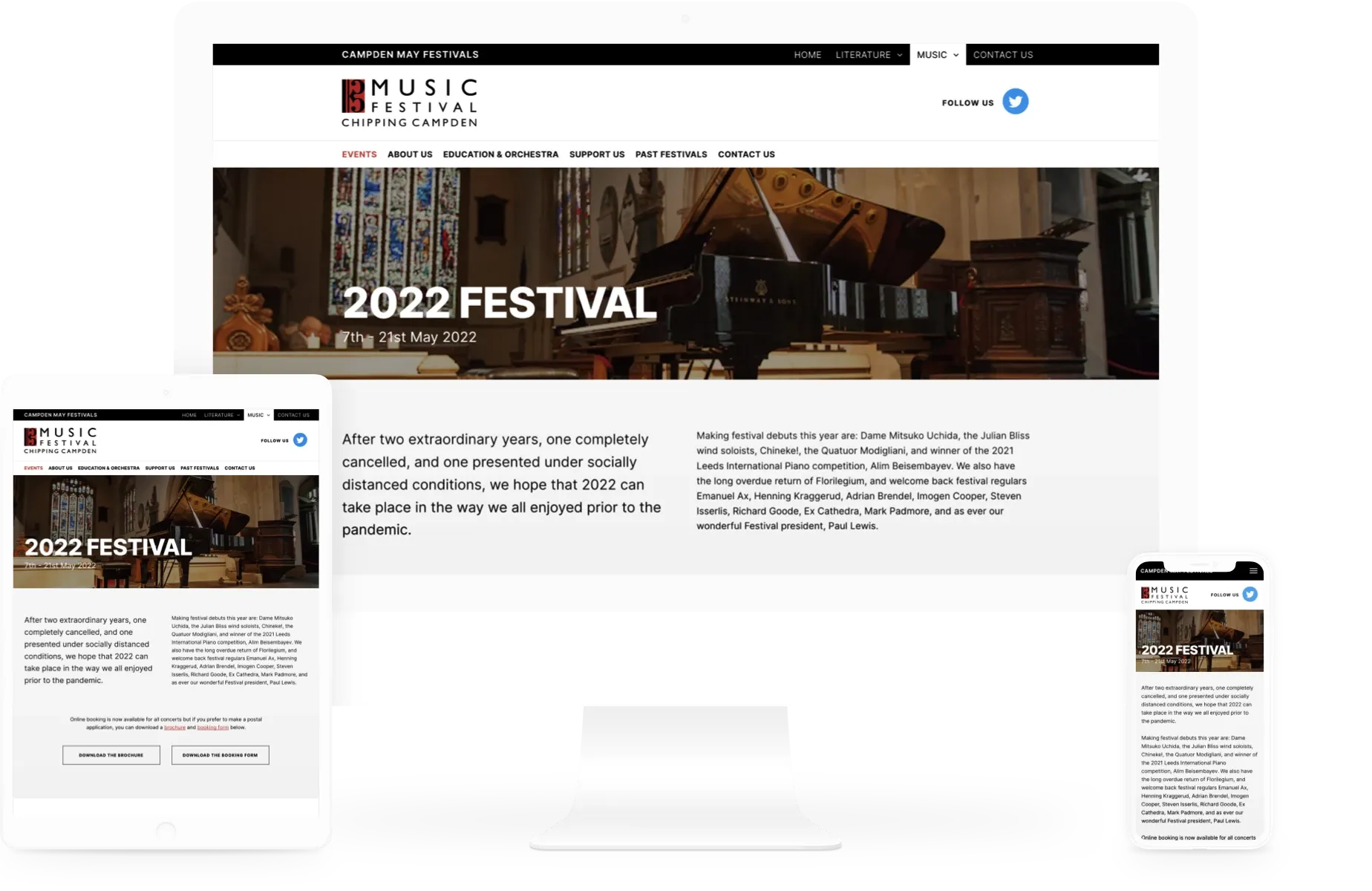A website for the 2022 festival is displayed on a computer monitor
