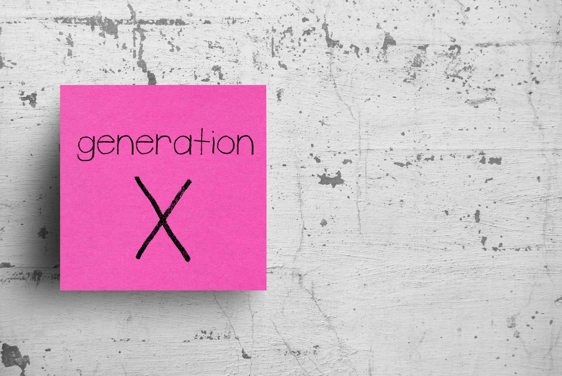 A pink sticky note with generation x written on it