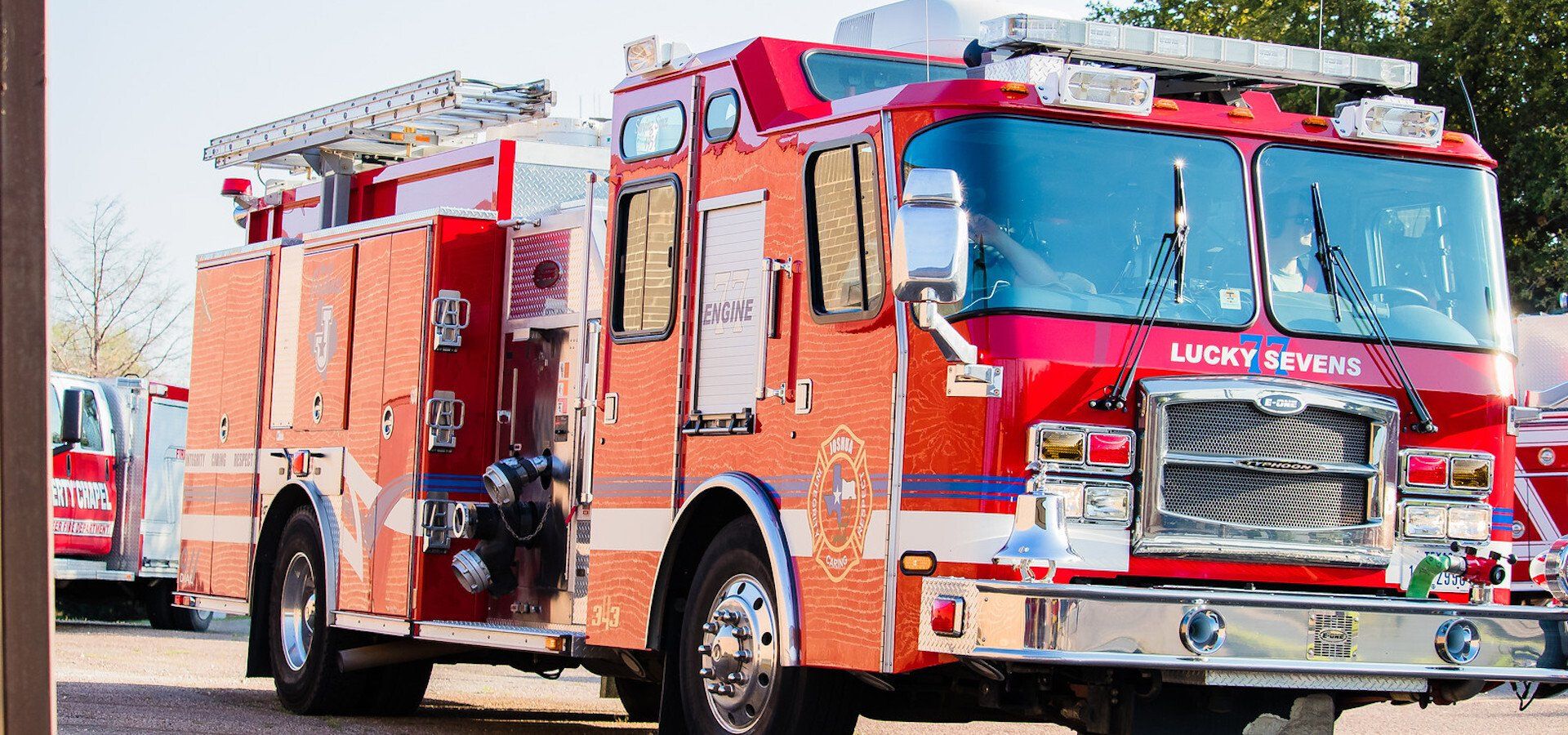A Joshua fire truck is parked in a parking lot.