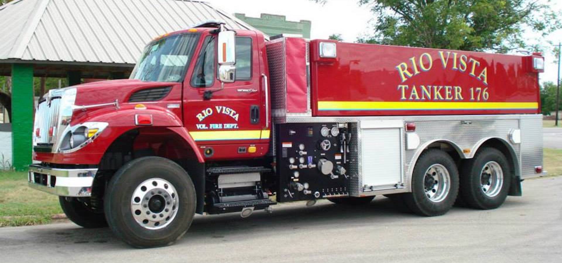 A Rio Vista tanker is parked on the side of the road