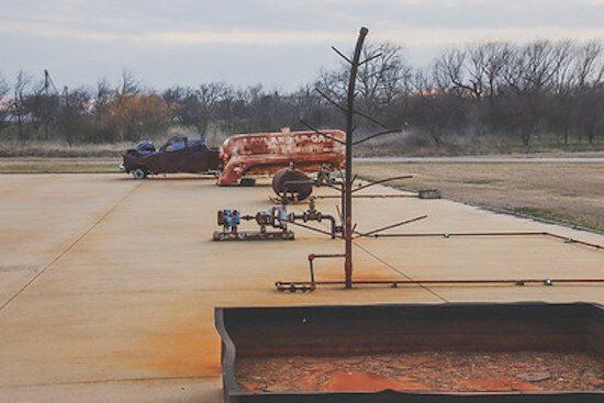Fire training props located on a concrete pad.