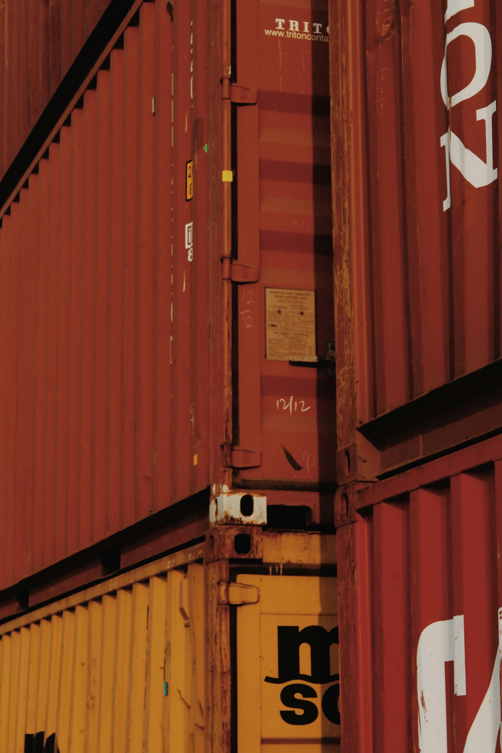A bunch of shipping containers are stacked on top of each other