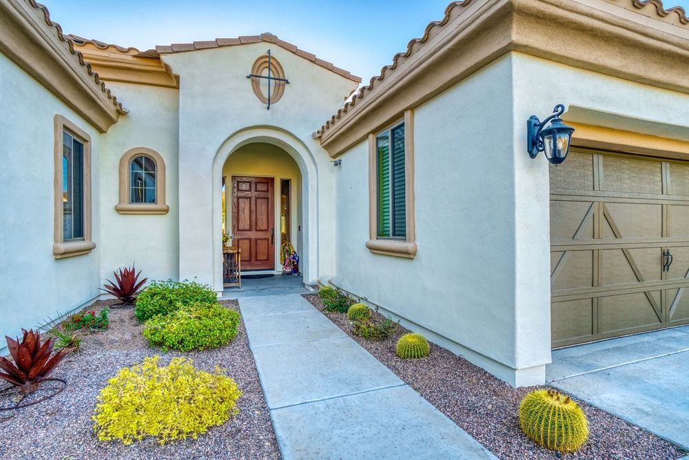 The front of a house with a walkway leading to it