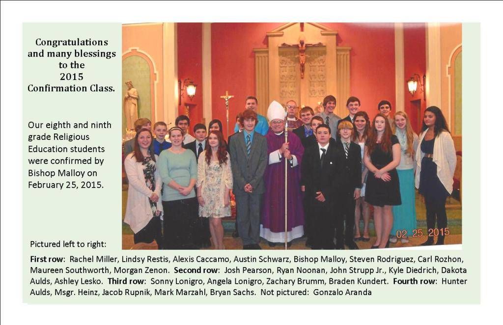 Group photo of people in a church sanctuary, posing in front of an altar and wooden cross.