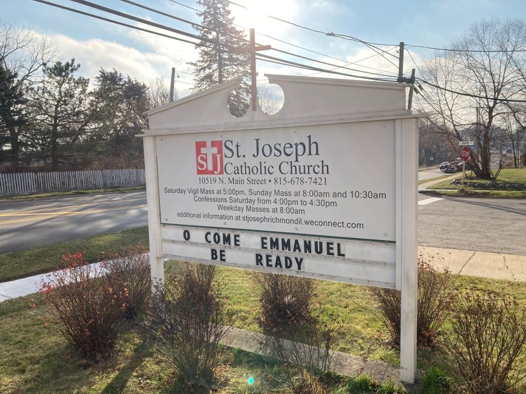 St. Joseph Church sign beside a road with “Come Emmanuel, Be Ready” message board