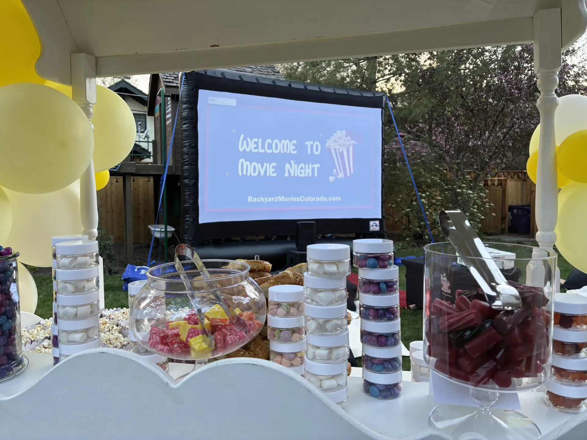 A screen that says welcome to movie night on it