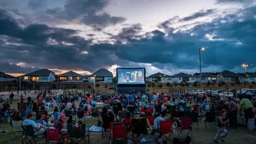 Inflatable movie screen showing a movie to a crowd at a local Castle Rock, CO event.