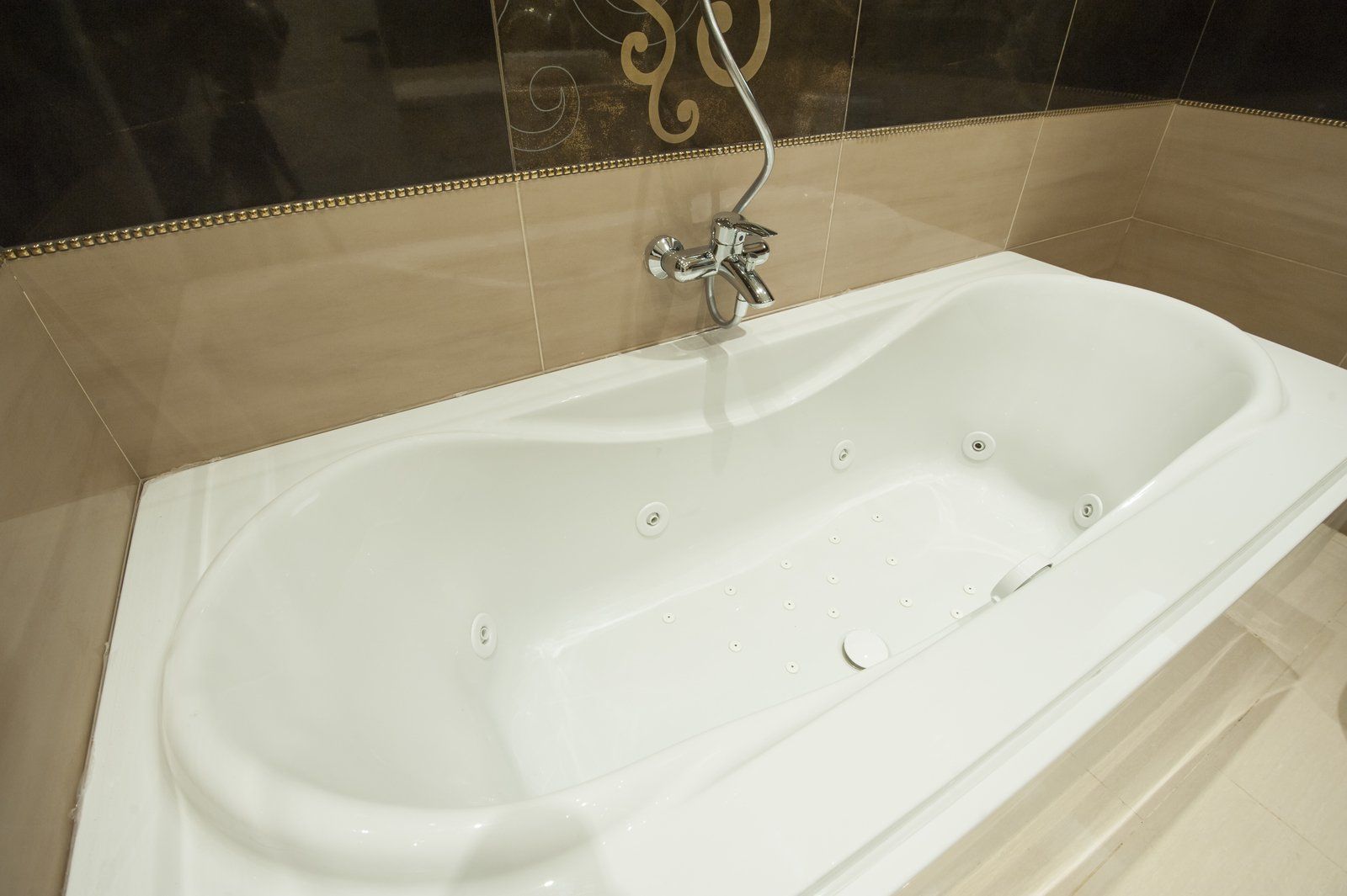 white bathtub with faucet