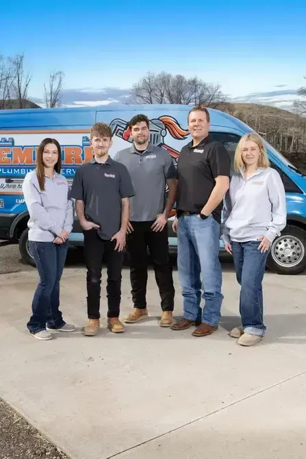 The Empire Plumbing Services team with their service van