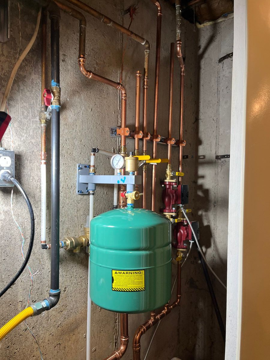 New boiler expansion tank and copper piping after installation