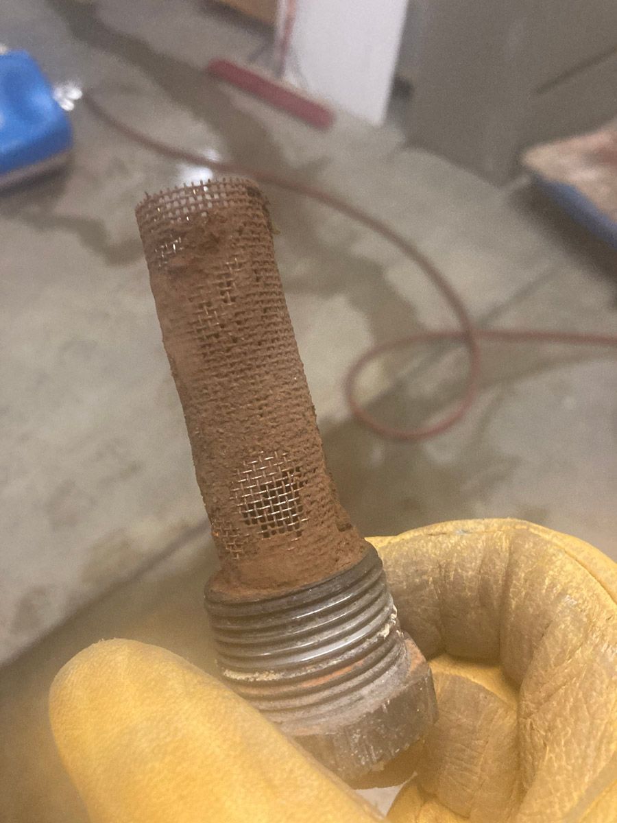 Mineral scale buildup on a boiler filter caused by Northern Utah hard water