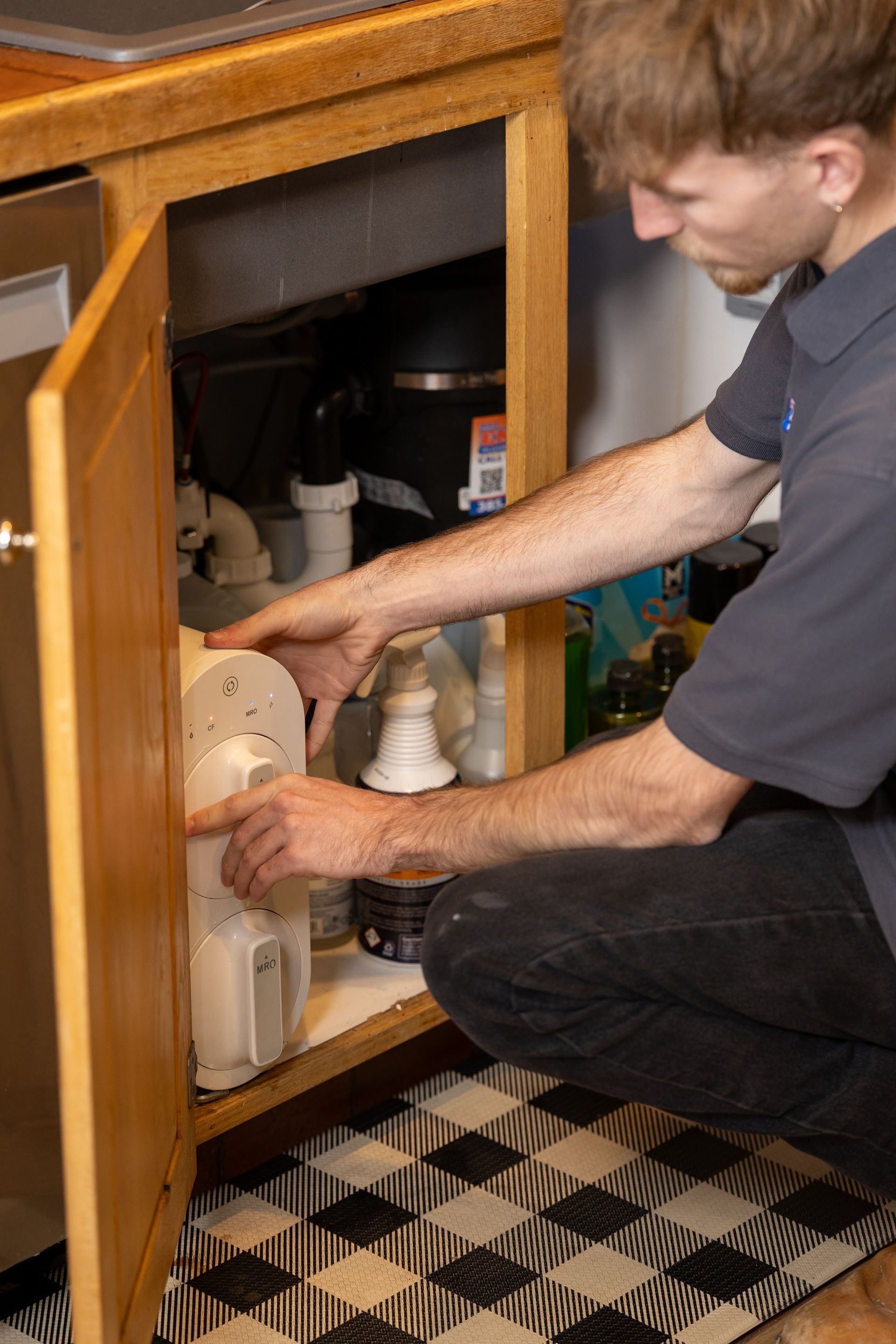 Plumber reviewing a written water heater estimate with a homeowner