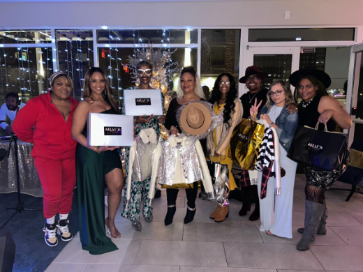 A group of women are posing for a picture together