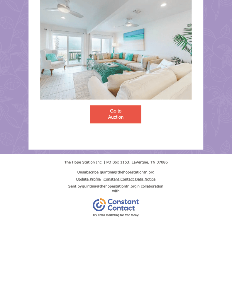 A picture of a living room with a couch and a ceiling fan.