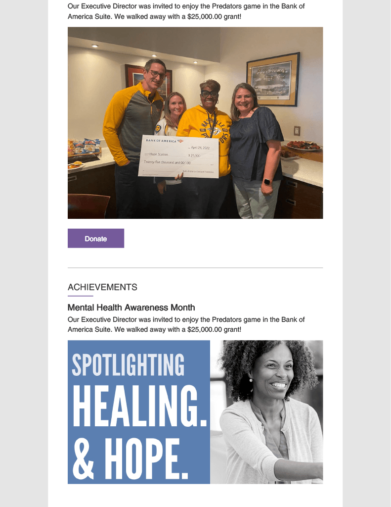 A group of people standing next to each other holding a check.