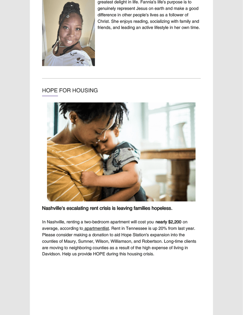 A woman is holding a baby in her arms.