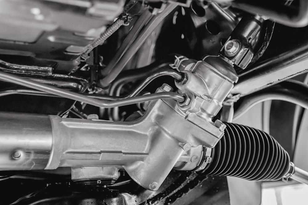 A Black And White Photo Of A Car Steering System — Mechanic in Lismore, NSW