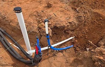Plumber fixing kitchen sink