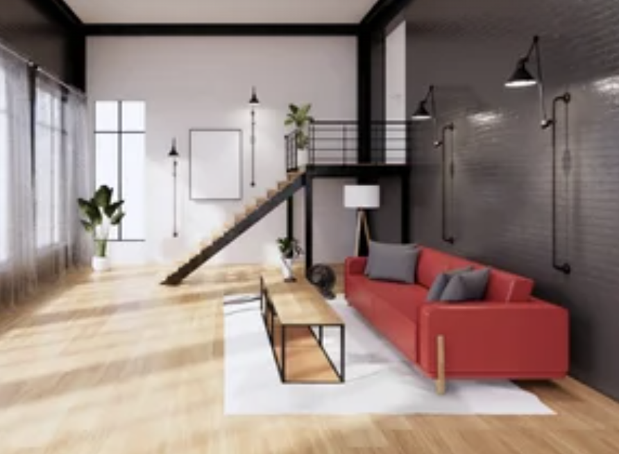 Modern loft living room with red sofa, staircase, large windows, and minimalist decor.