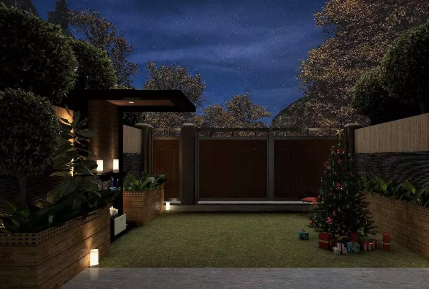 Modern courtyard garden at night with brick walls, trees, and warm pathway lighting