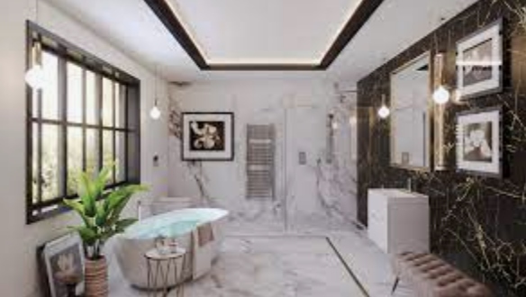 Bright marble bathroom with black and gold accents, large windows, and a potted plant by a glass table