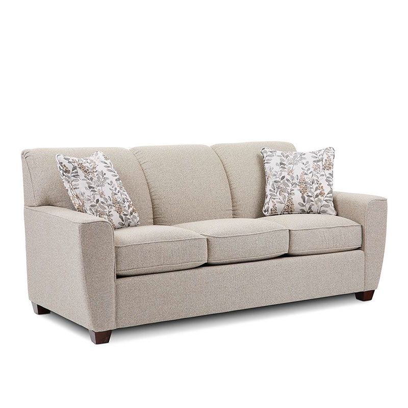 Beige three-seat sofa with patterned throw pillows on a white background