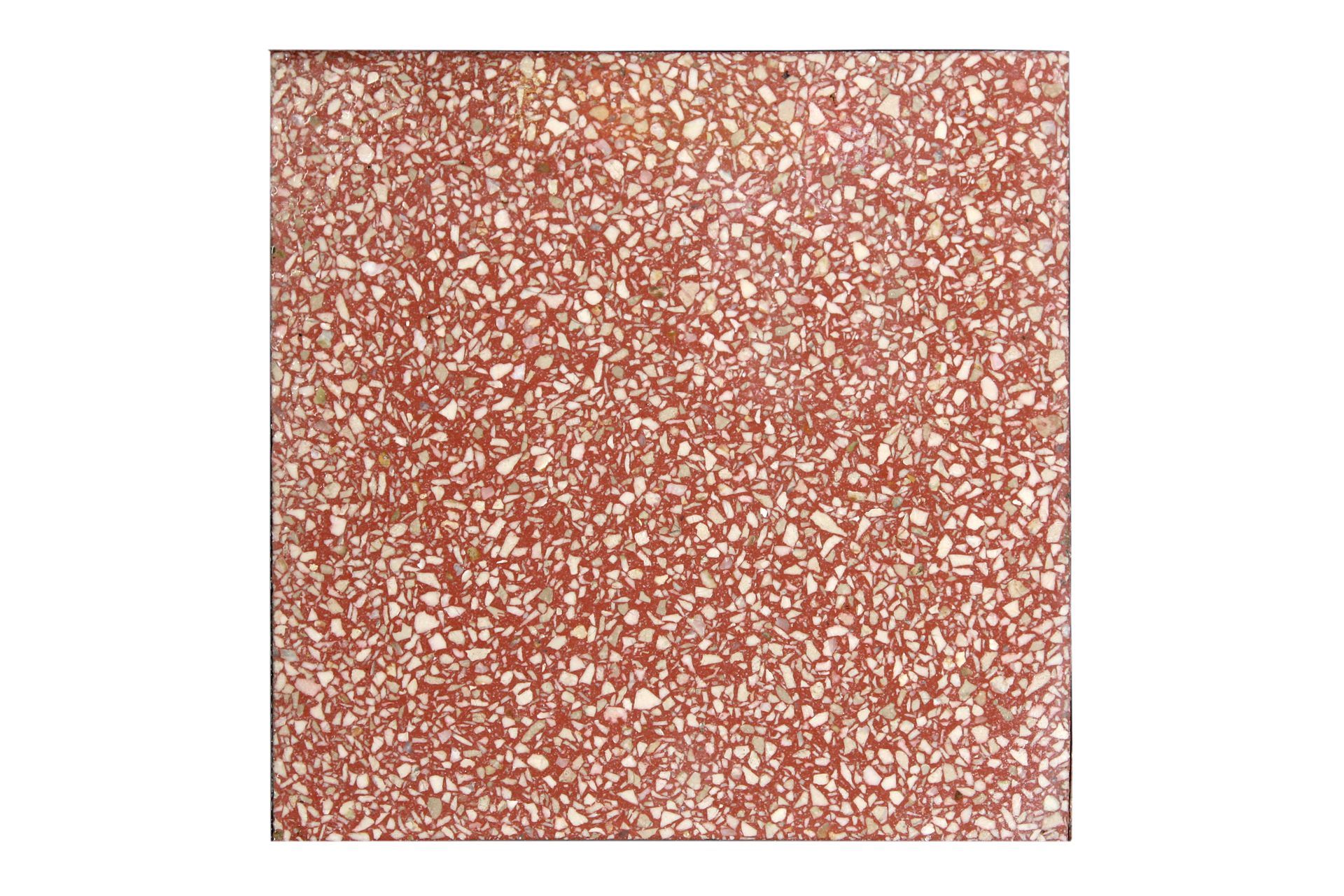 Piastrella quadrata in terracotta con motivo a macchie bianche e rosse.