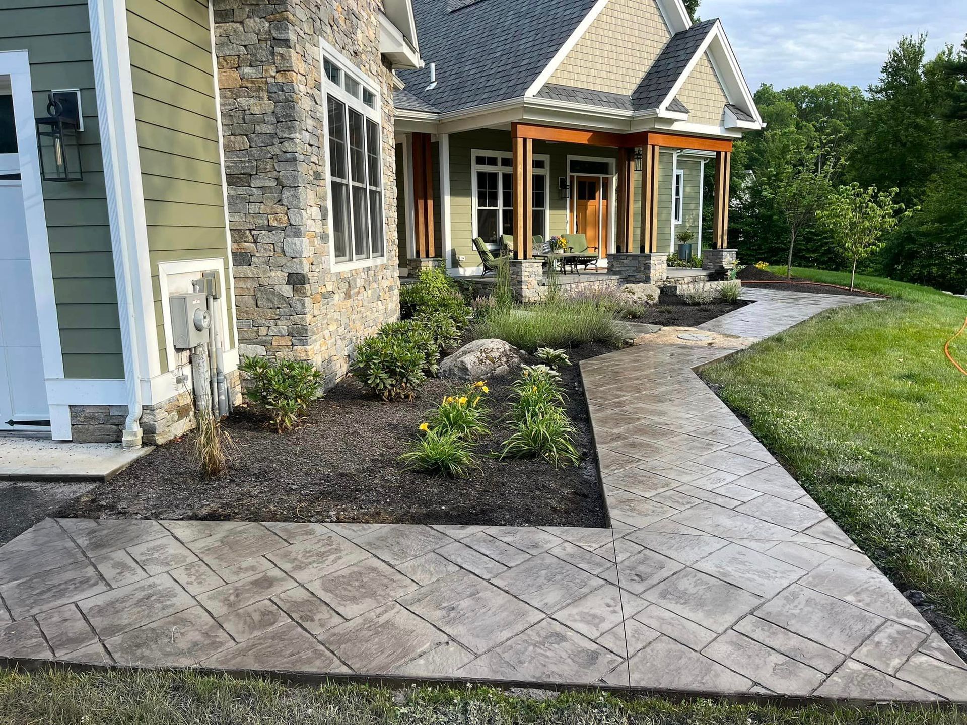 beautiful stamped concrete sidewalk on front yard