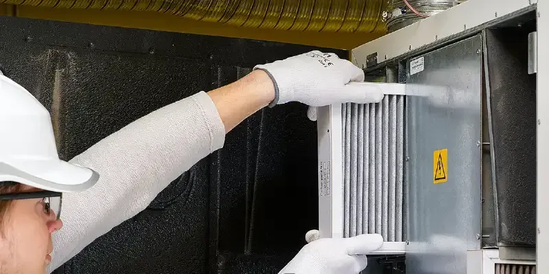 Lady Removing Dirty Air Filter