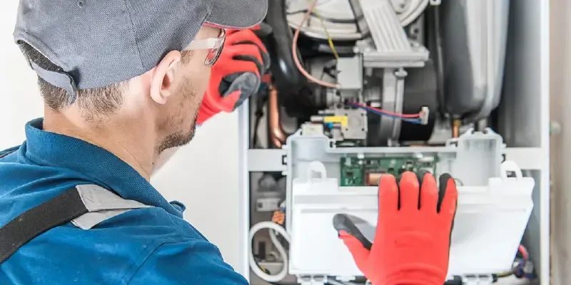 Man fixing Furnace